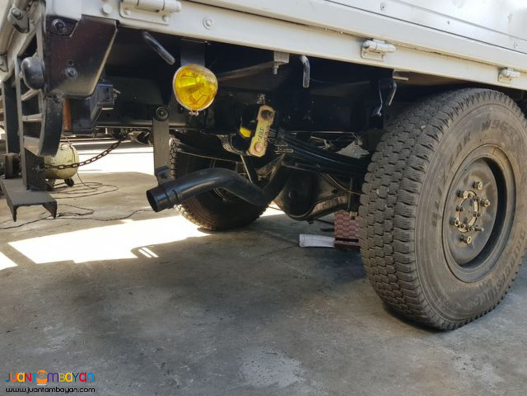 Dropside Cargo Truck ISUZU Elf - 4 Wheeler